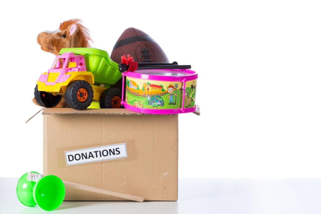 A box of old toys for donation gathered from the basement.